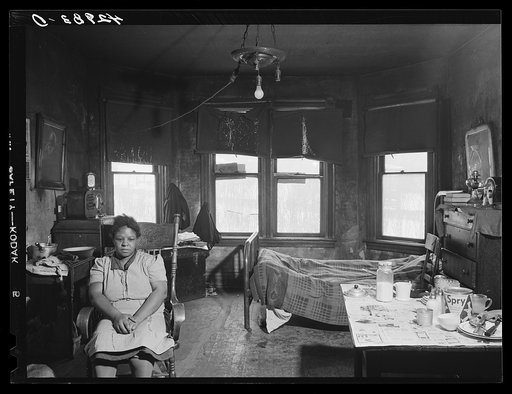 Negro woman living with her family in a dilapidated house in the Mount Washington district of Beaver Falls, Pennsylvania