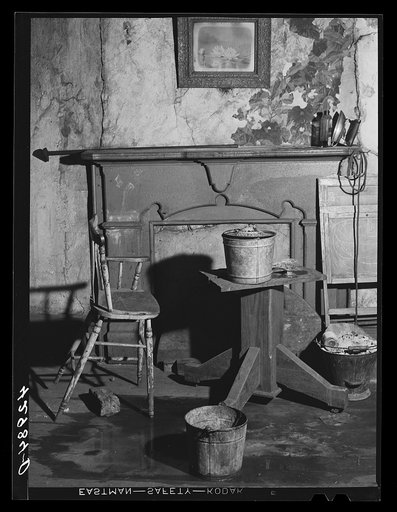 Untitled photo, possibly related to: Buckets placed in room to catch water from leaky ceiling in a house in Mount Washington district. Beaver Falls, Pennsylvania