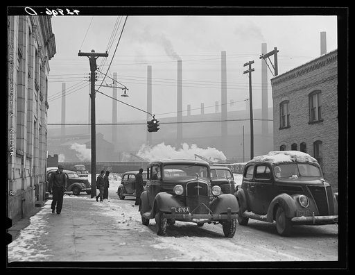 Cars of steelworkers leaving the mill in Midland, Pennsylvania