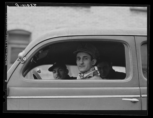 Steelworkers driving to work at Pittsburgh Crucible Steel Company in Midland, Pennsylvania