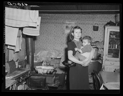 Woman and her child living in a slum house in Bridgewater, Pennsylvania. Her husband is a steelworker