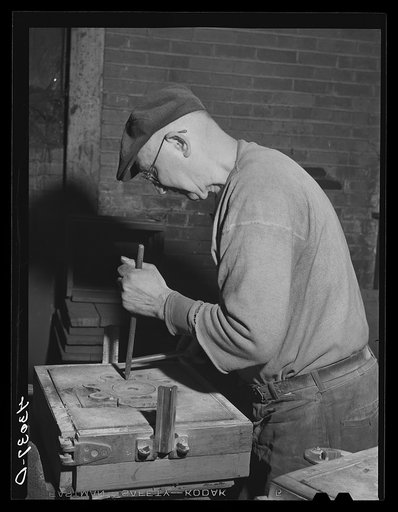 Moulder at work in Correct Manufacturing Company. Fallston, Pennsylvania