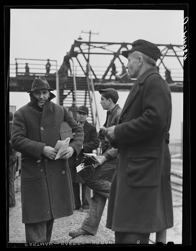 Men going home at the end of the afternoon shift outside the Jones and Laughlin Steel Corporation. Aliquippa Pennsylvania