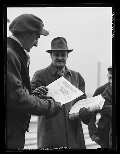 Untitled photo, possibly related to: Steelworkers going home at the end of the afternoon shift. A union official is distributing "Steel Labor" outside the Jones and Laughlin Steel Corporation in Aliquippa Pennsylvania