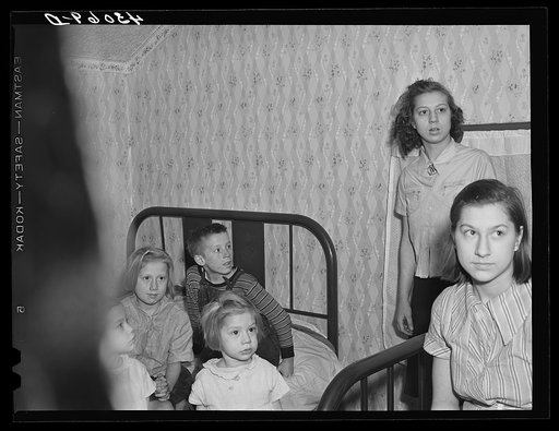 Untitled photo, possibly related to: Daughter of a worker at the Pittsburgh Crucible Steel Corporation of Midland, Pennsylvania. Her father is at present in bed as a result of a leg injury at the mill. There are seven children and they help out by selling magazines from door to door. The pump is the