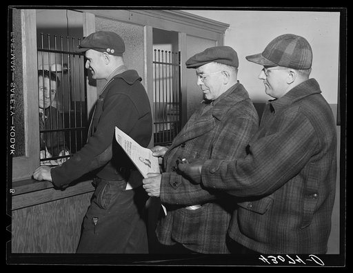 Paying dues at the union hall of the steelworkers' organizing committee in Aliquippa, Pennsylvania
