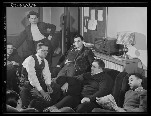 Steelworkers of the Serbian Club listening to the Joe Louis fight at their club headquarters in Aliquippa, Pennsylvania