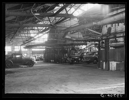 A closed glass works in Rochester, Pennsylvania, now used for car storage