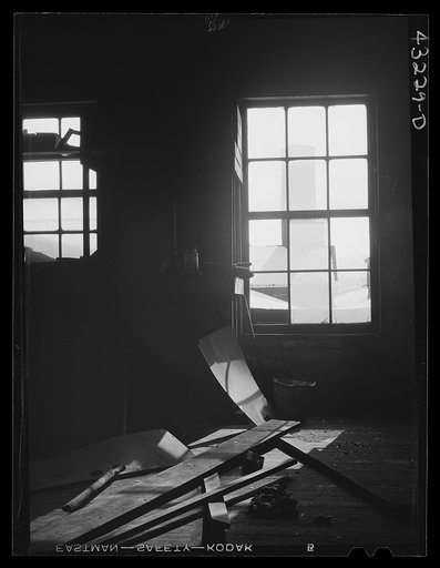 Untitled photo, possibly related to: Auto graveyard seen thru a window of the abandoned Olive Stove Works, Rochester, Pennsylvania