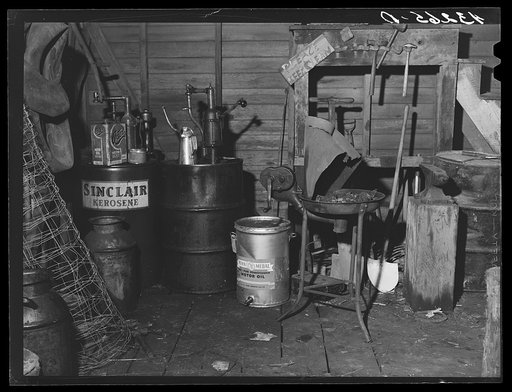 Oil cans and soldering equipment in barn on farm near Rockville, Maryland