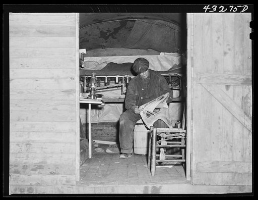 This man is a carpenter at Fort Bragg, North Carolina. This converted truck is his home. The interior of his truck was more roomy than most of the cabins that had been built at the camp where he was staying. At a settlement near Silver Lake, North Carolina (about ten miles out of Fayetteville, N.C.)