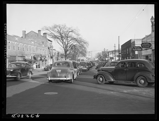 Traffic on the main street of Fayetteville, North Carolina at about five o'clock, when the workers start coming out of Fort Bragg, North Carolina