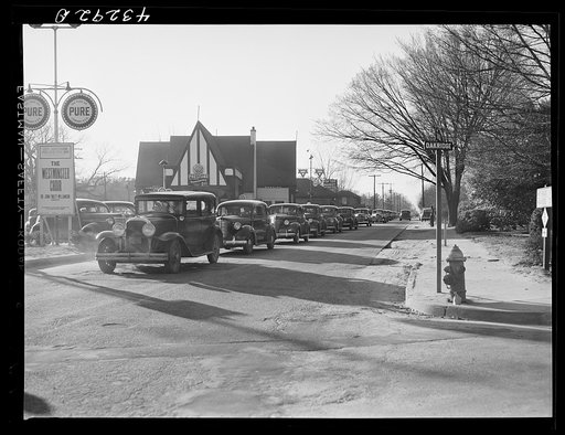 Untitled photo, possibly related to: Traffic on the main highway from Fort Bragg, North Carolina to Fayetteville, at the time when the workers are coming out of fort. North Carolina
