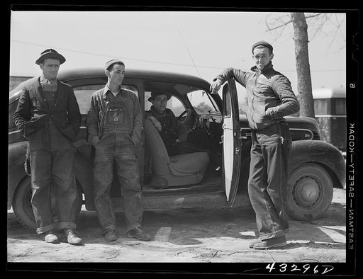 These men stopped at a trailer settlement to see about buying a trailer. They were very uncertain about how long their work would continue at Fort Bragg. Near Fayetteville, North Carolina