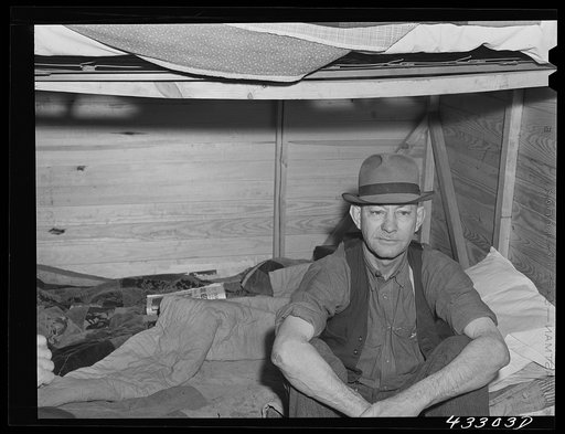 Four men live in this small shack. Two sleep on the lower cot and two on the upper. The whole shack is made so that it can be loaded onto a truck, has no floor all. At present the men work at Fort Bragg, North Carolina. Near Fayetteville, North Carolina