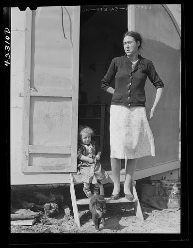 Untitled photo, possibly related to: Her husband works at Fort Bragg, and expects to be laid off any day. They come from South Carolina and have been living in a trailer for two years.  Don't know where they will go next. Near Fort Bragg, North Carolina