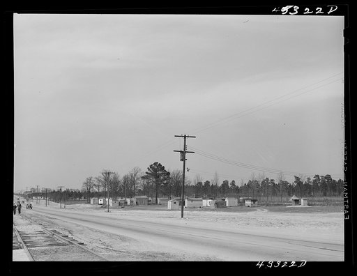 View of a settlement of shacks and trailers occupied by workers from Fort Bragg. Along Fayetteville--Fort Bragg road. North Carolina