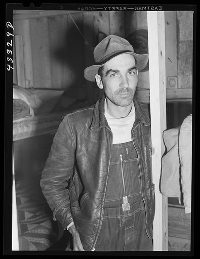 Worker employed at Fort Bragg and renting a lower berth in a bunkhouse recently constructed behind a filling station. Near Silver Lake, North Carolina