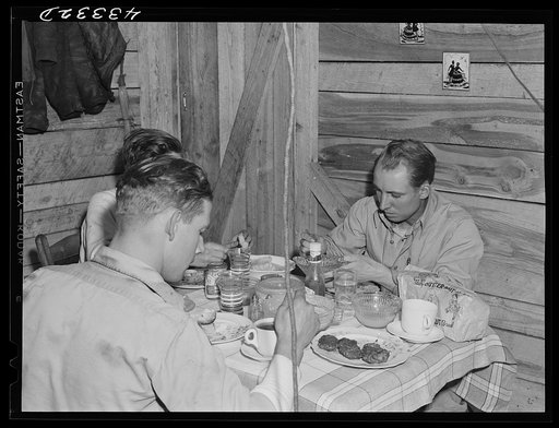 Untitled photo, possibly related to: Truckers from Fort Bragg having supper in their shack near Manchester, North Carolina