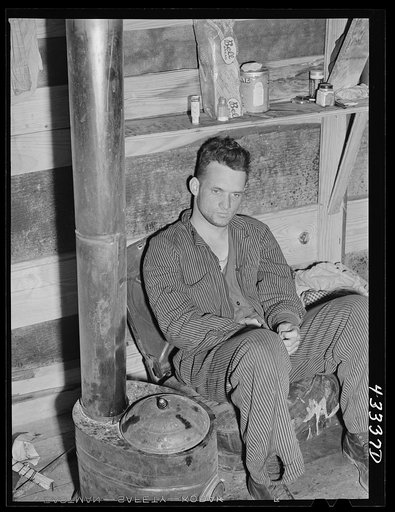 This truck driver from Fort Bragg lives with three others in a little shack near Fayetteville, North Carolina. They come from Selma, North Carolina.  All expect to be laid off next payday