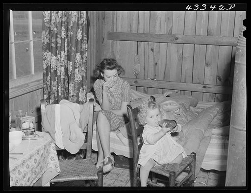 In the second story of tobacco barn used as living quarters by family of workers from Fort Bragg, North Carolina, near Fayetteville, North Carolina