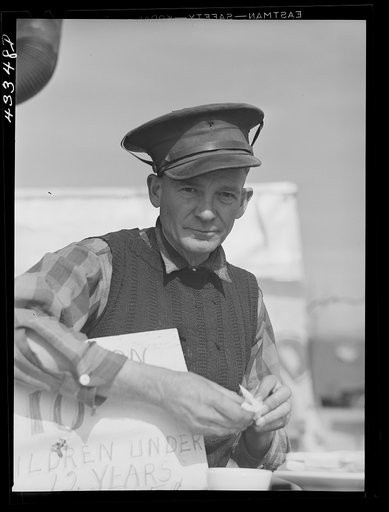 Untitled photo, possibly related to: At the travelling sideshow "crime museum" with the owner, an old war veteran, and some of his "specimens". Near Fort Bragg, North Carolina