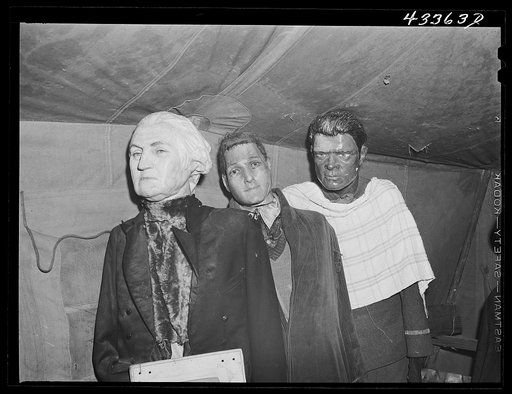 Effigies of Washington, Joe Louis and some criminal in a travelling sideshow "crime museum". Washington and Joe Louis are examples of "what you may become if you go straight". Near Fort Bragg, North Carolina