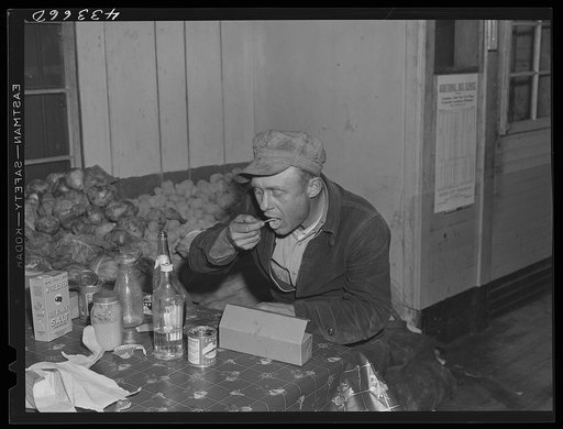 Worker from Fort Bragg having his dinner at a crossroads store in Manchester, North Carolina