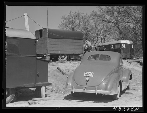 Untitled photo, possibly related to: In a trailer settlement of workers from Fort Bragg. Manchester, North Carolina. The closest trailer is occupied by workers who came from Idaho