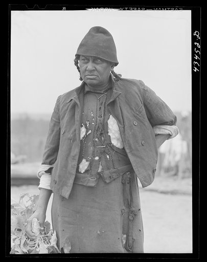 Untitled photo, possibly related to: Miss Mary Haines has lived all her life on her small farm in the Camp Croft area. She is planning to move but wants to come back "after all the shootin' is over." Near Whitestone, South Carolina