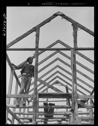 Many families tore down their houses in the Santee-Cooper Basin to rebuild them outside the area. Near Bonneau, South Carolina March, 1941