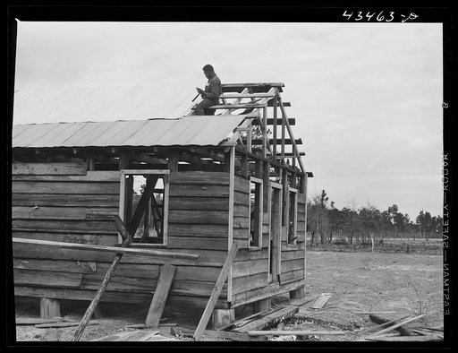 Rebuilding a house carried out of the Santee-Cooper Basin near Moncks Corner, South Carolina