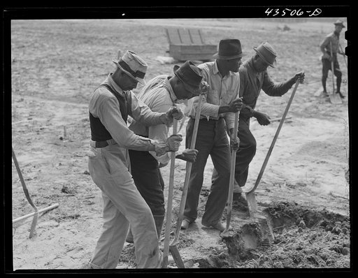Digging new graves for a cemetery that is being moved out of the Santee-Cooper basin. Near Bonneau, South Carolina