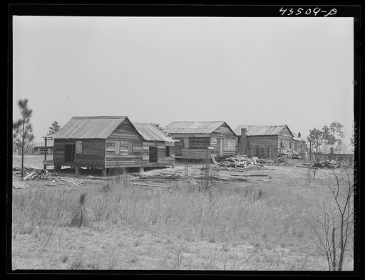 These houses were on an eight acre plot where eight Negro families were resettled by a landowner whose plantation was to be flooded by the Santee Cooper navigation project. Near Moncks Corner, South Carolina