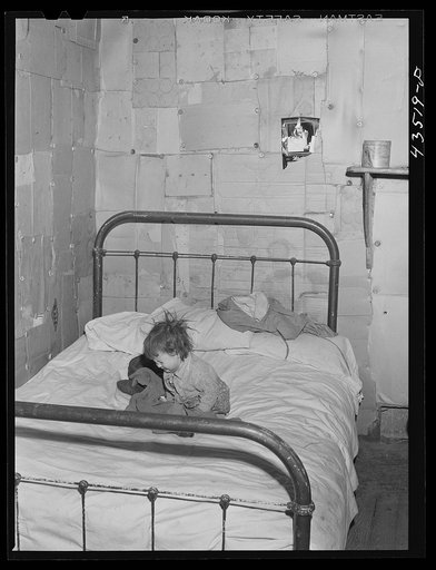 Untitled photo, possibly related to: In the home of a "squatter" family that was preparing to move off the Camp Croft area. Near Whitestone, South Carolina
