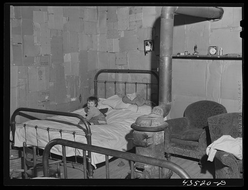 In the home of a "squatter" family that was preparing to move off the Camp Croft area. Near Whitestone, South Carolina