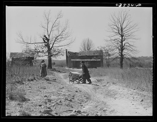 Untitled photo, possibly related to: House occupied by "squatter" family that was preparing to move out of the Spartanburg Army camp area. Near Whitestone South Carolina