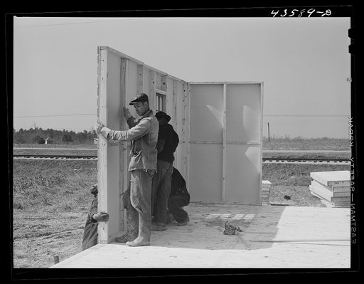 Putting up the first walls for FSA (Farm Security Administration) prefabricated houses for farmers who had to move out of the area. Pacolet, South Carolina