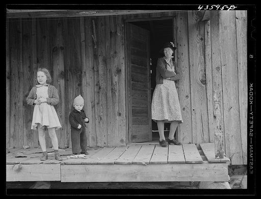 Untitled photo, possibly related to: A tenant family in the Camp Croft area watching their belongings being moved out. Near Whitestone, South Carolina