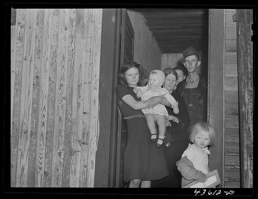 Untitled photo, possibly related to: Relatives of the aged Harvey sisters who have come to help them move out of their home in the Camp Croft area. Near Whitestone, South Carolina