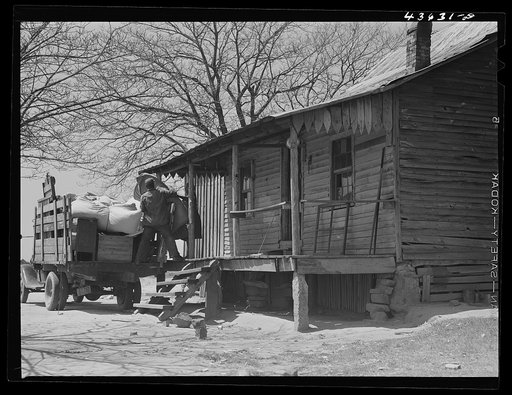 Negro family who have come out of the Camp Croft area moving into their "new" home near Pacolet, South Carolina region