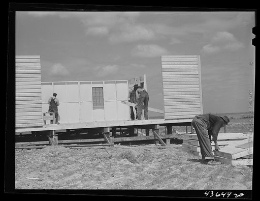 Putting up the walls on a prefabricated house at the FSA (Farm Security Administration) project in Pacolet, South Carolina