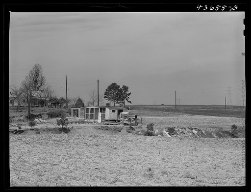 Landscape in Camp Croft showing trailer family moving out. Near Pacolet, South Carolina