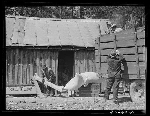 Negro family moving out of Camp Croft area collecting some belongings from a relative. Near Spartanburg, South Carolina region