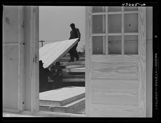 Untitled photo, possibly related to: Truckload of sections for one of the prefabricated houses being built at Pacolet, South Carolina for farmers moved out of the Camp Croft area