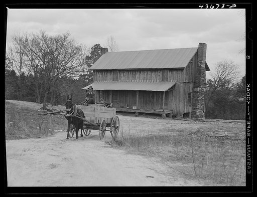 Tenant farmer moving the last of his load out of his farmer home in Camp Croft area. Near Whitestone, South Carolina