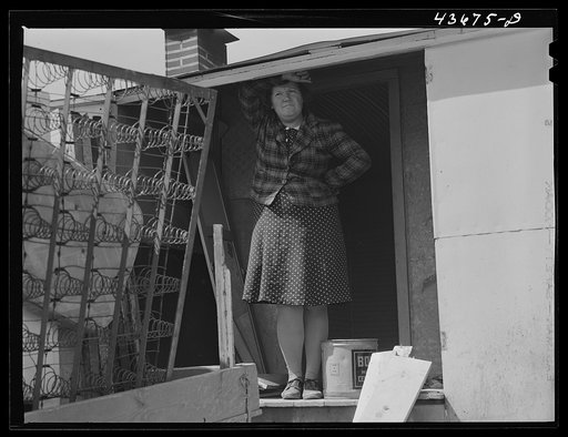 Untitled photo, possibly related to: This farmer owned one acre of land and small improvised trailer in which he and his wife lived. The only place they could find to move was a small farm they rented which had only a barn on it Near Pacolet, South Carolina region