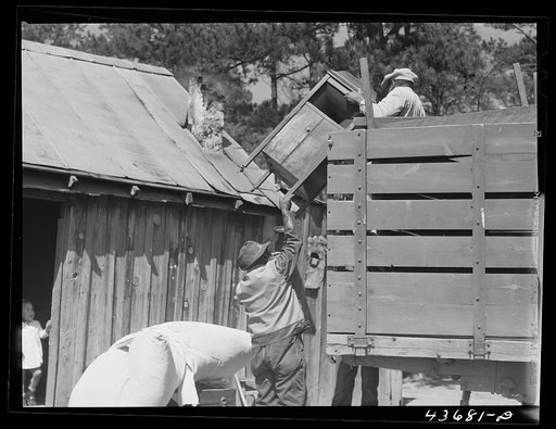Negro family who has moved out of the Camp Croft area picking up some of their belongings