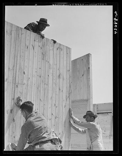 Putting up a wall in one of the prefabricated houses being built at Pacolet, South Carolina for farmers moved out of Camp Croft area