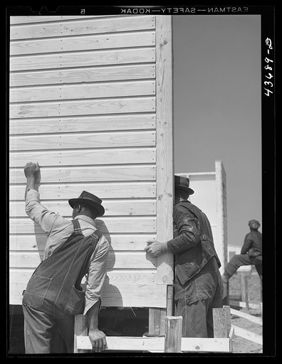 Putting up a wall in one of the prefabricated houses being built at Pacolet, South Carolina for farmers moved out of Camp Croft area